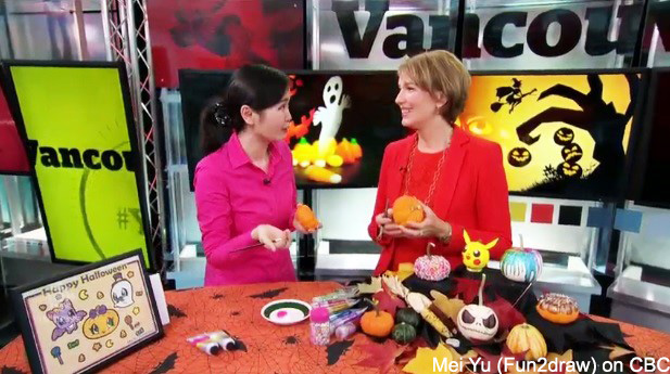 Screencap from CBC's Our Vancouver segment, where Mei Yu goes over her Halloween 
				DIY art.