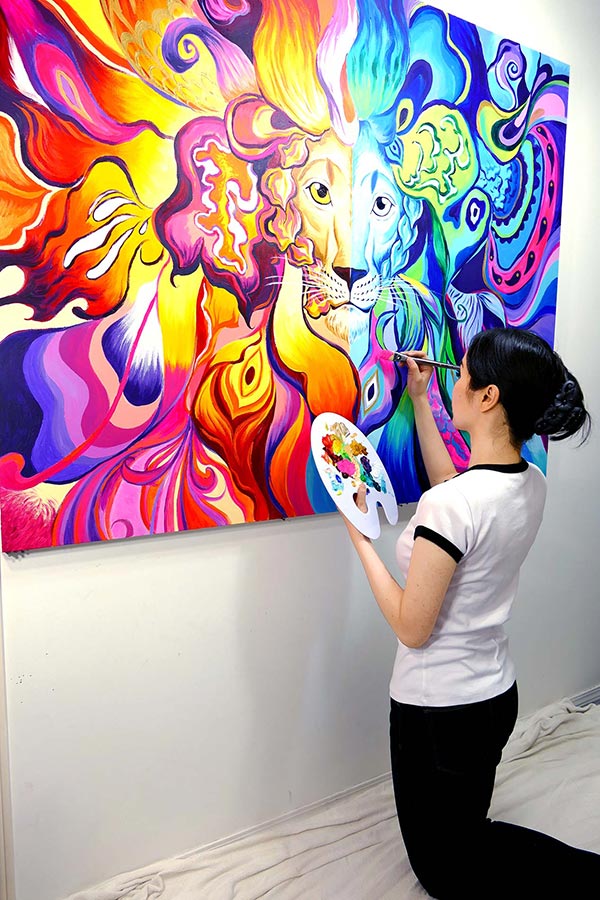 Photo of Mei Yu, working on one of her art challenges for her YouTube fans.